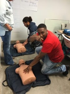 Learning CPR during orientation week. Safety first at Landforce!